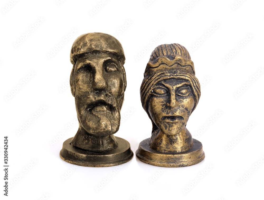 Figurines Scandinavian supreme god Odin (Woden) and his spouse goddess Frigg isolated on white background Figurines Scandinavian supreme god Odin (Woden) and his spouse goddess Frigg isolated on white background