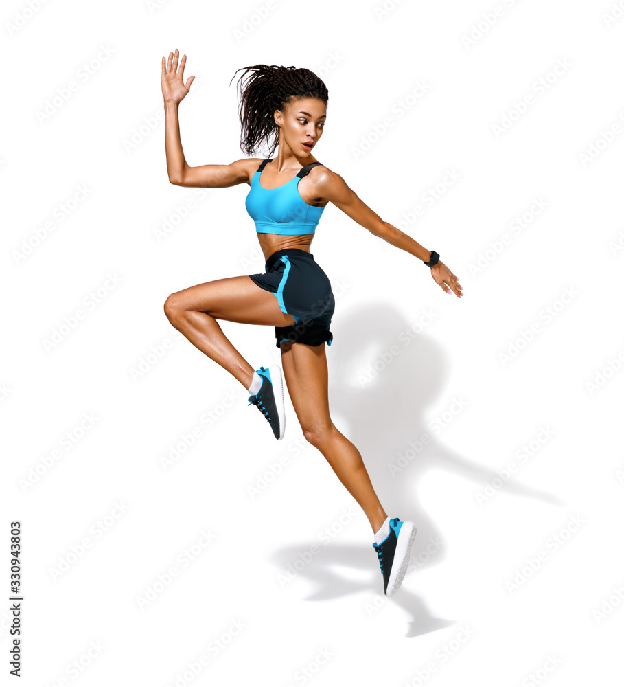 Sporty girl runner in silhouette. Photo of african american girl in fashionable sportswear on white background. Dynamic movement. Side view. Full length. Sports and healthy lifestyle