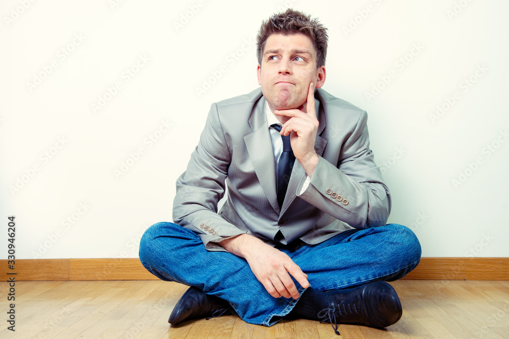 Portrait of a man sitting in interrogative expression. Business concept, idea Portrait of a man sitting in interrogative expression. Business concept, idea