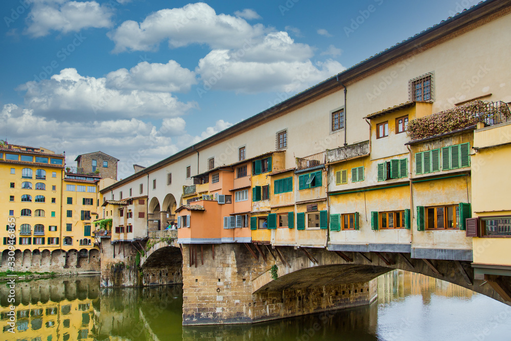 The colorful and historic Ponte Vecchio over the Arno River in Florence, Italy