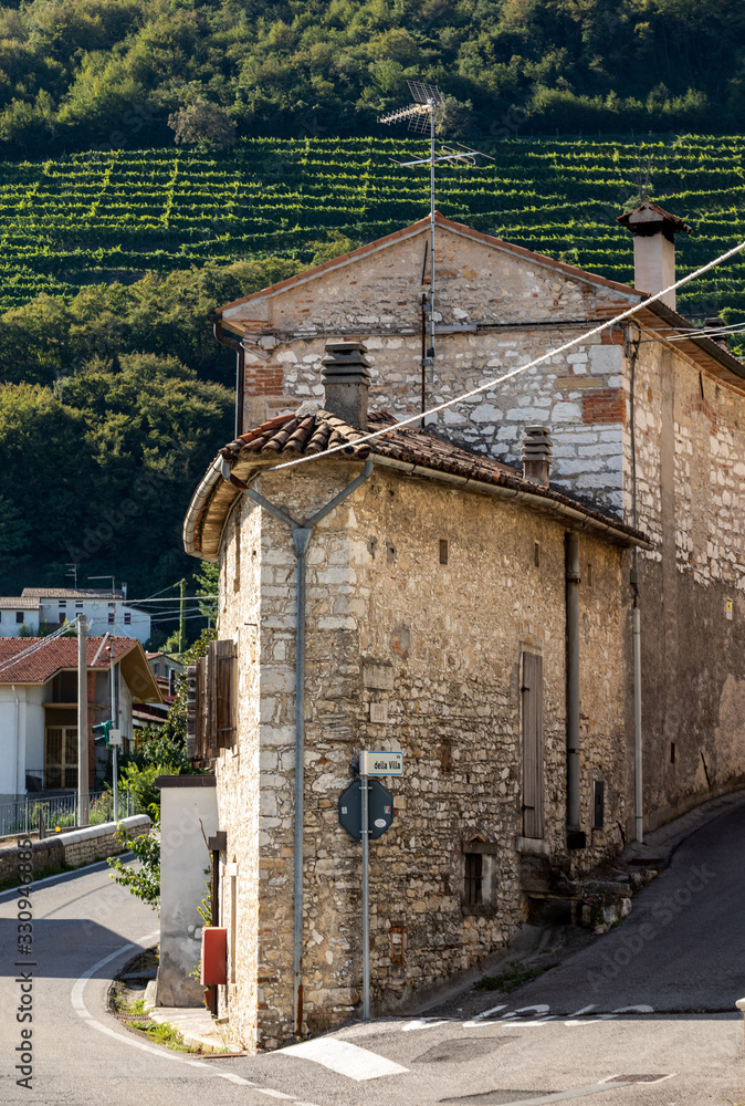  Santo Stefano- small old town and hill with vineyards of the Prosecco sparkling wine region near Valdobbiadene, Italy.