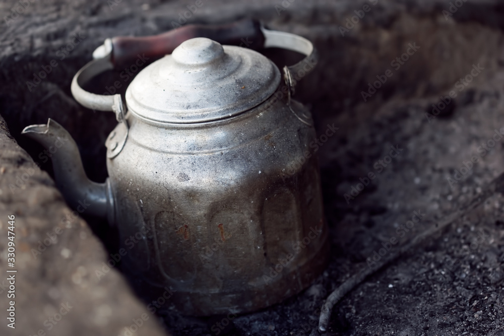Kettle with moroccan tea on barbecue, Essaouira, Morocco 