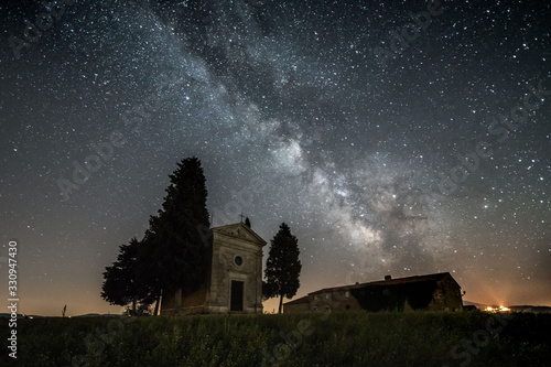 Night in the famous Chapel Vitaleta in Tuscany, with milky way on the sky, Italy