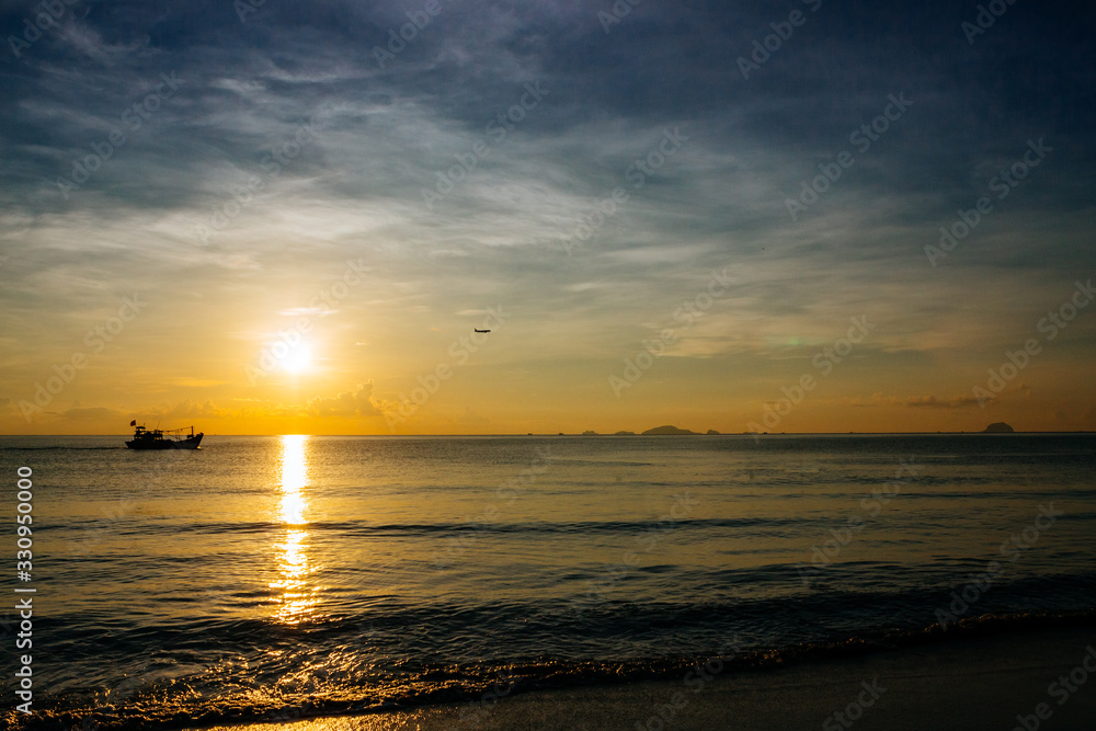 Sunrise, sunset of the sun through the clouds, tropical area near sea. Sunrise, sunset of the sun through the clouds, tropical area near sea.