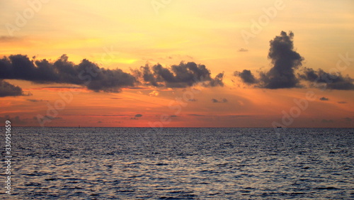 A beautiful and romantic sunset at the Maldives seen from a luxurious villa. Holidaying in Maldives without seeing a sunset is a bit like going to Paris without seeing the Eiffel Tower.