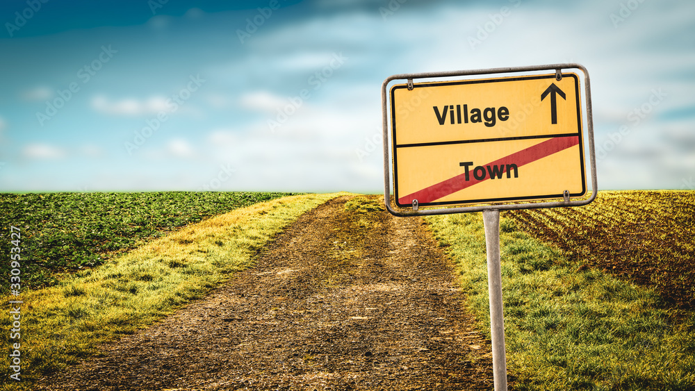 Obraz premium Street Sign to Village versus Town