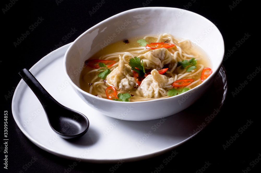 Miso Ramen with dim sum and vegetables in a bowl Miso Ramen with dim sum and vegetables in a bowl