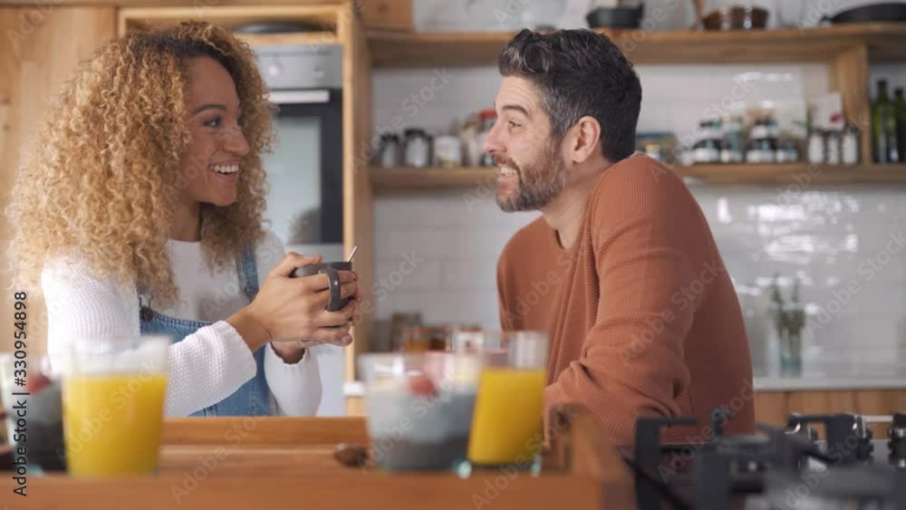 Couple having breakfast in kitchen. Couple having breakfast in kitchen.