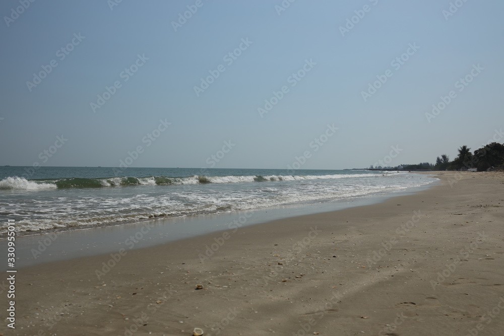 Empty thai beach with a quiet sea