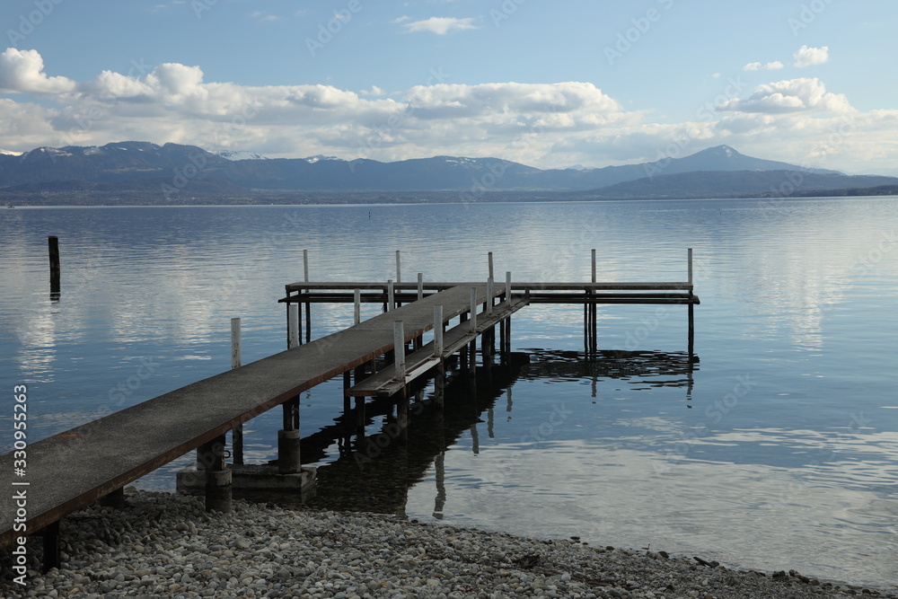 Side view of a pontoon over a quiet lake in Switzerland