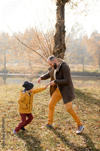 Happy family is playing in nature.