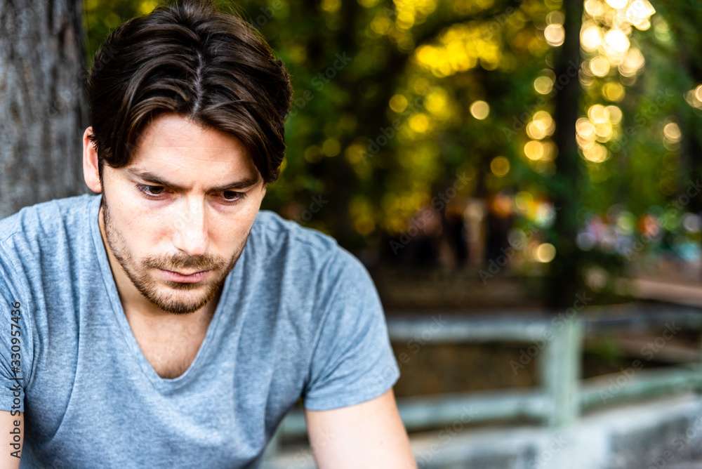 Portrait of a serious young man with doubts about his future job and economic recession. Portrait of a serious young man with doubts about his future job and economic recession.