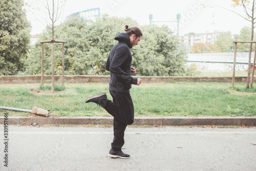 Young caucasian man jogging cross country