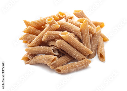 Raw Wholegrain penne pasta isolated on a white background