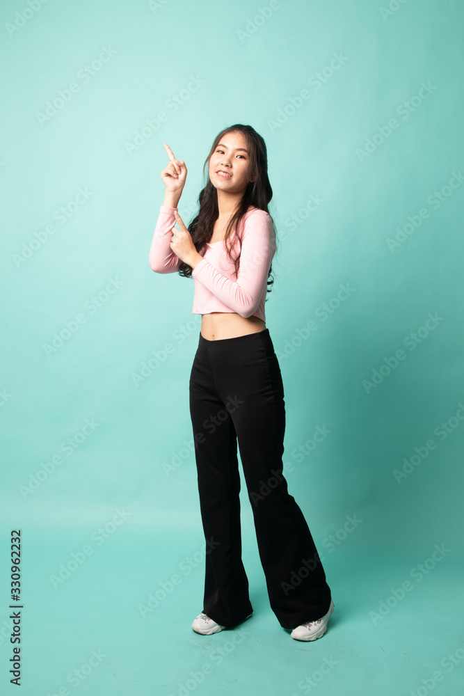 Full body of beautiful young asian woman pointing up. Full body of beautiful young asian woman pointing up.