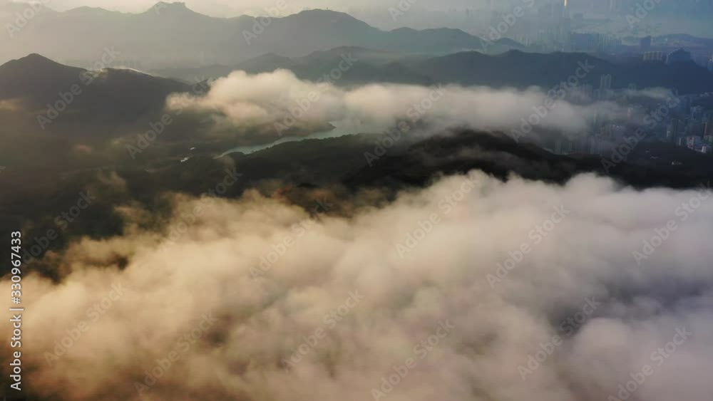 Fabulous scenery of clouds hanging over mountains on tropical coastline of Tai Mo Shan, Hong Kong Fabulous scenery of clouds hanging over mountains on tropical coastline of Tai Mo Shan, Hong Kong
