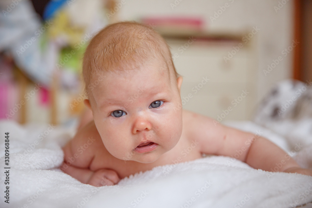 baby in bed. a newborn baby is lying on the bed at home baby in bed. a newborn baby is lying on the bed at home