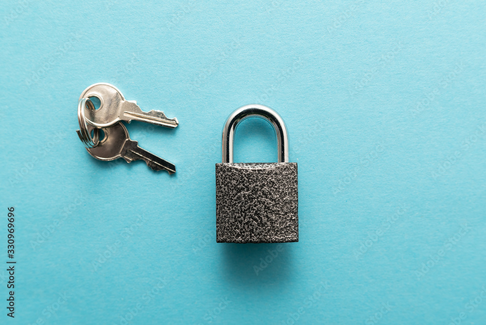 Metal lock isolated on blue background. Metal lock isolated on blue background.