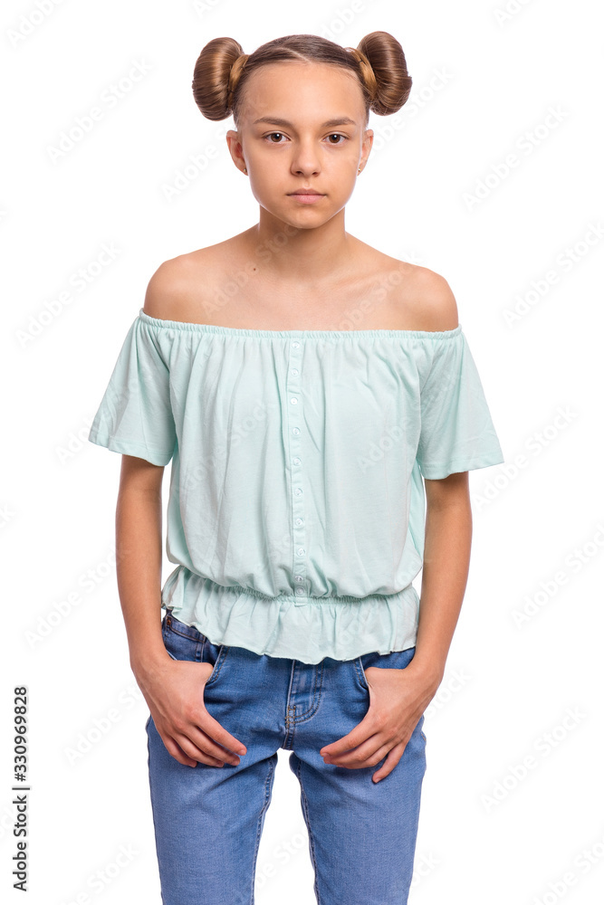 Portrait of teen girl with funny hairstyle, isolated on white background. Cute child putting hands in pockets and looking at camera. Beautiful young caucasian teenager. Front view. Portrait of teen girl with funny hairstyle, isolated on white background. Cute child putting hands in pockets and looking at camera. Beautiful young caucasian teenager. Front view.