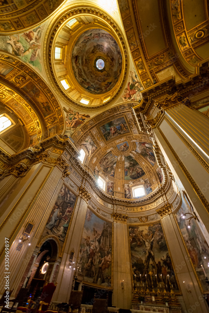 ROME, ITALY - May 2, 2015: The nave of baroque church Basilica di Sant Andrea della Valle. Famous basilica, Piazza Vidoni, built in Baroque style, 1608 AD. Church interior with reflection.