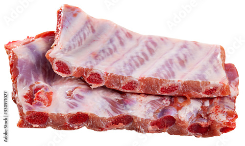 Raw fesh spare ribs on a wooden surface