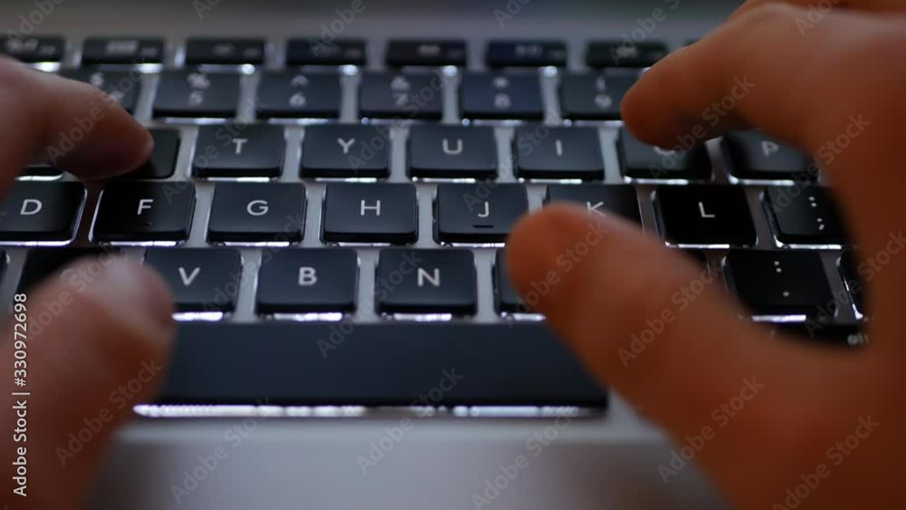 Fingers typing on laptop keyboard close-up concept footage Fingers typing on laptop keyboard close-up concept footage