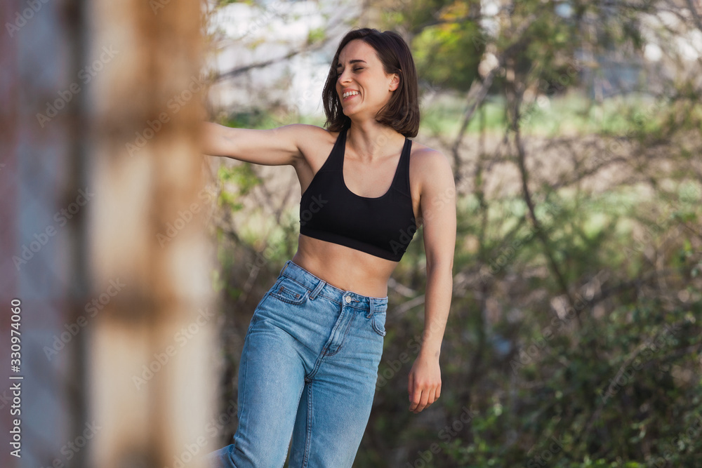 Young woman grabs ancient metal fence freedom concept Young woman grabs ancient metal fence freedom concept