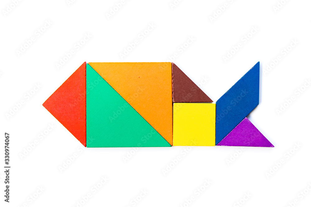 Color wood tangram puzzle in fish shape on white background Color wood tangram puzzle in fish shape on white background