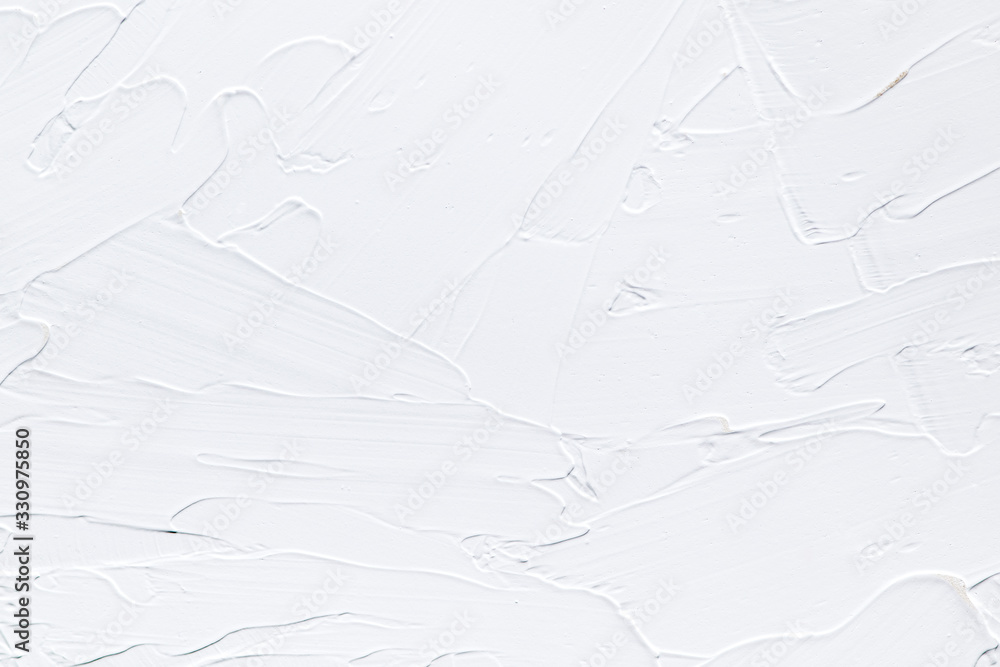 White plastered wall texture with visible spatula strokes. Clean and detailed textured wall background or wallpaper image.
