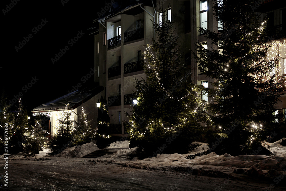 Naklejka premium Beautiful modern hotel at night. Winter vacation