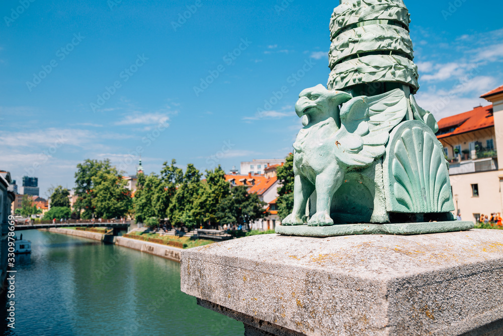 Ljubljana symbol dragon sculpture at Dragon Bridge Zmajski most in Ljubljana, Slovenia