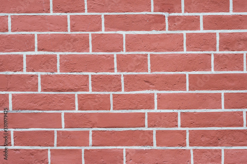 The brick wall is red with white joints. Textured background