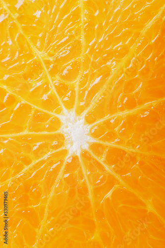 juicy fresh ripe orange in a section close-up, macro
