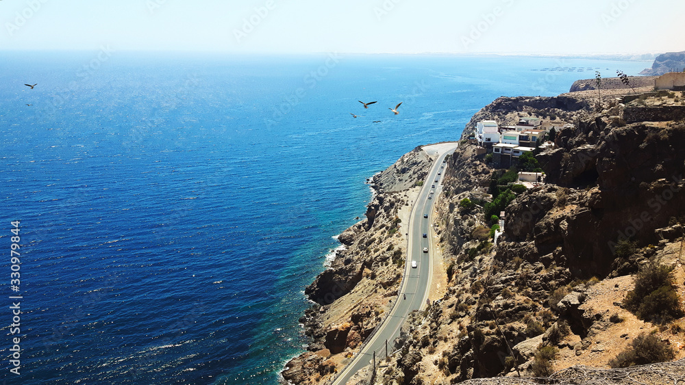 Spani mediteranean sea view with roads and cars on the clifs