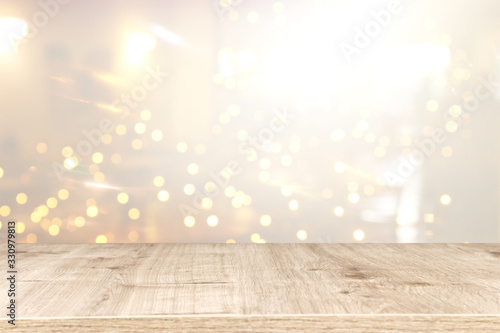 Wallpaper Mural Photo of old wooden table in front of gold and silver glitter lights background. Ready for product display montage. Torontodigital.ca