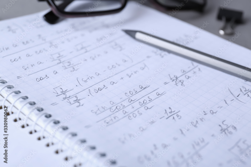 Notebook with pencil on table, closeup. Doing homework Notebook with pencil on table, closeup. Doing homework