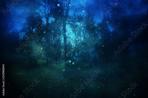 Abstract and mysterious background of blurred forest. Halloween concept and fairy tale