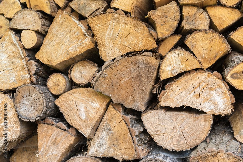 Wall of stacked wood logs for background Wall of stacked wood logs for background