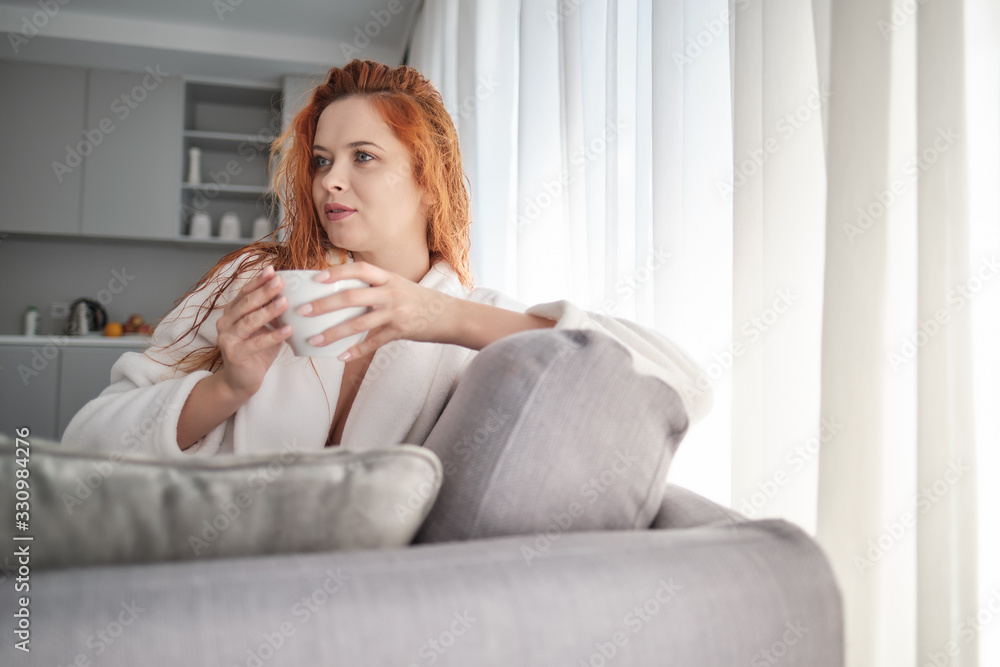Red haired woman drink morning coffee at home Red haired woman drink morning coffee at home