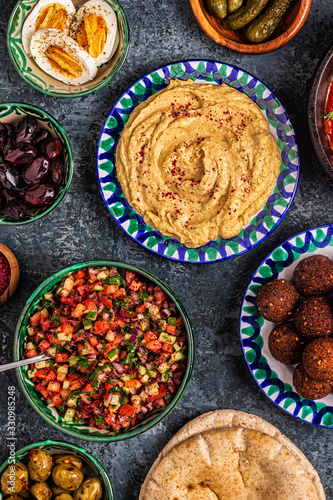 Falafel, hummus, shakshuka, Israeli salad - traditional dishes of Israeli cuisine.