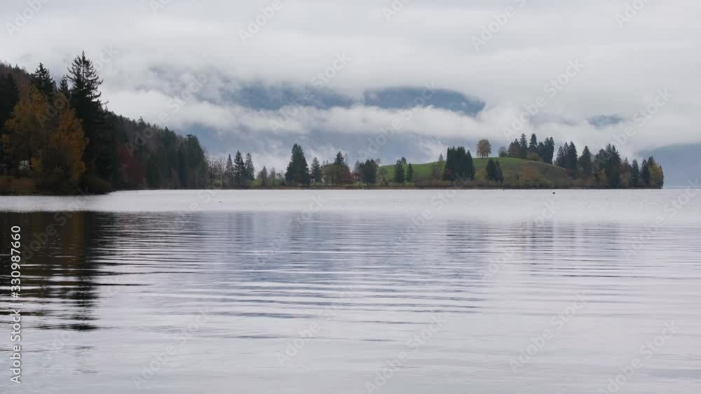 Mountain alpine autumn overcast evening lake Walchensee view, Kochel, Bavaria, Germany. Picturesque traveling, seasonal and nature beauty concept scene. Mountain alpine autumn overcast evening lake Walchensee view, Kochel, Bavaria, Germany. Picturesque traveling, seasonal and nature beauty concept scene.
