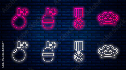 Set line Hand grenade, Military reward medal, Hand grenade and Brass knuckles. Glowing neon icon on brick wall. Vector