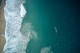 Aerial view of two fishers boats in the turquoise waters in Kerala, India