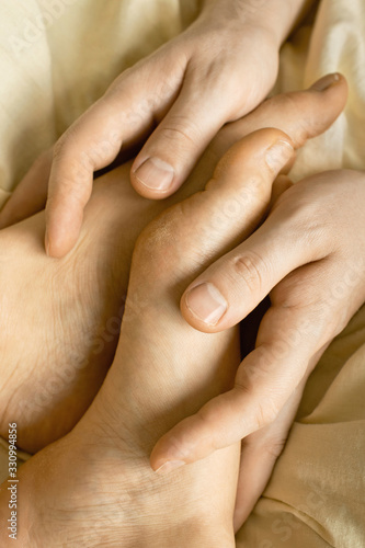 A symbol of love and support. hands and feet of a man and a Valentine's day.
