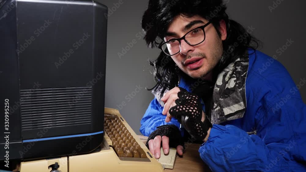 Computer geek from the 70s 80s talking to the camera about his vintage