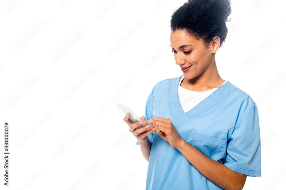 African american nurse using smartphone isolated on white