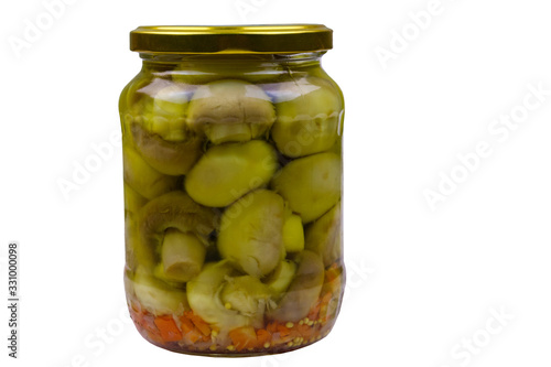 Delicious marinated mushrooms in glass jar isolated on white background