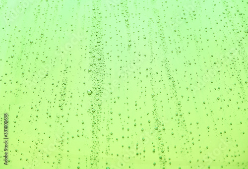Close up of water drops on background. Abstarct  texture with bubbles on window glass surface. Raindrop  Realistic pure water droplets condensed for creative banner design