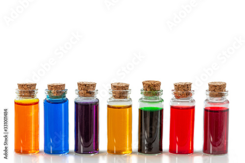 bottles of food coloring isolated on a white background