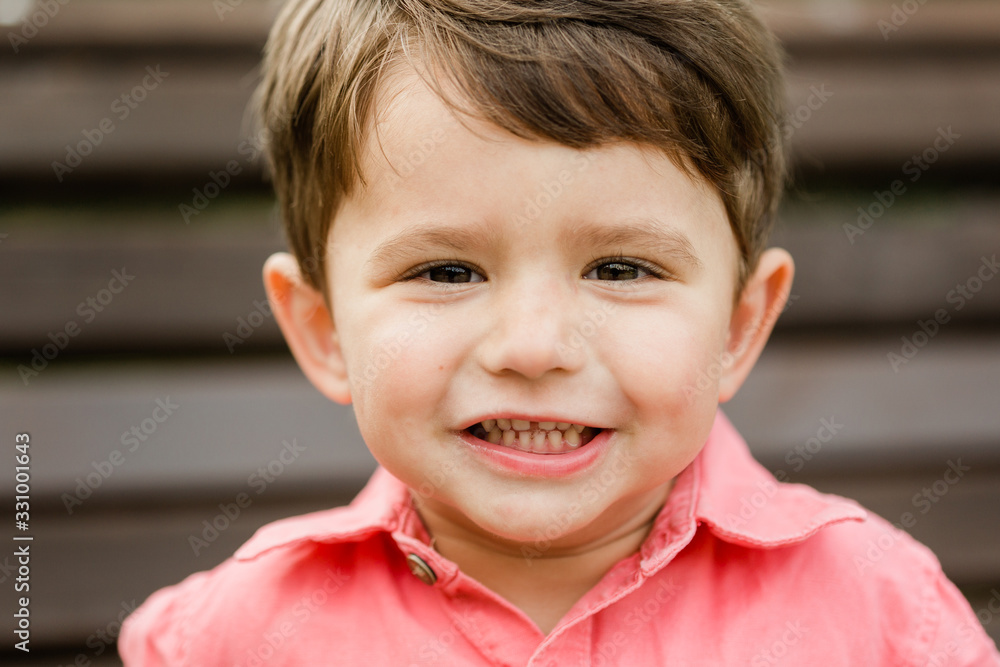 Closeup portrait of little cheerful boy. Happy laughing child Closeup portrait of little cheerful boy. Happy laughing child